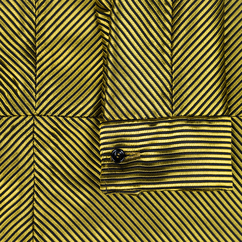 Vestido camisero de hilo dorado y negro con espalda en forma de estrella, mezcla de seda y poliéster, hecho en España. Detalle puño.  Ana de Valle. Remolona